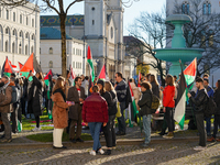 A demonstration in Munich, Germany, on November 16, 2024, includes pro-Palestinian demonstrators and pro-Israeli counter-demonstrators with...