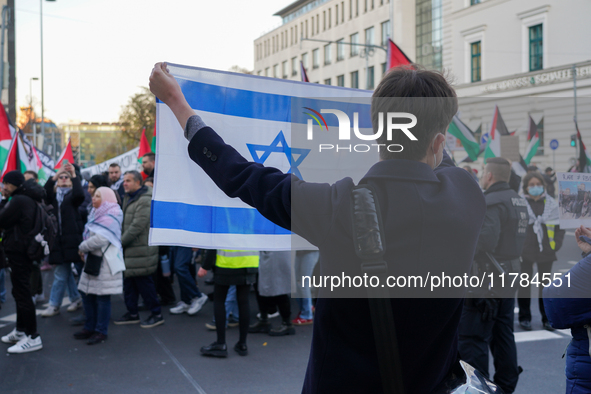 A demonstration in Munich, Germany, on November 16, 2024, includes pro-Palestinian demonstrators and pro-Israeli counter-demonstrators with...