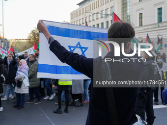 A demonstration in Munich, Germany, on November 16, 2024, includes pro-Palestinian demonstrators and pro-Israeli counter-demonstrators with...