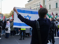 A demonstration in Munich, Germany, on November 16, 2024, includes pro-Palestinian demonstrators and pro-Israeli counter-demonstrators with...