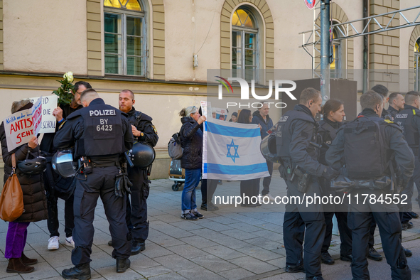 A demonstration in Munich, Germany, on November 16, 2024, includes pro-Palestinian demonstrators and pro-Israeli counter-demonstrators with...