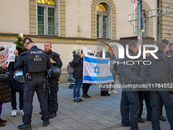 A demonstration in Munich, Germany, on November 16, 2024, includes pro-Palestinian demonstrators and pro-Israeli counter-demonstrators with...