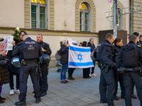 A demonstration in Munich, Germany, on November 16, 2024, includes pro-Palestinian demonstrators and pro-Israeli counter-demonstrators with...