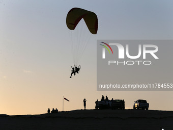 The photo, taken in Oued Souf, Algeria, on November 16, 2024, shows a sunset during the 6th International Saharan Tourism Festival (FITS). O...