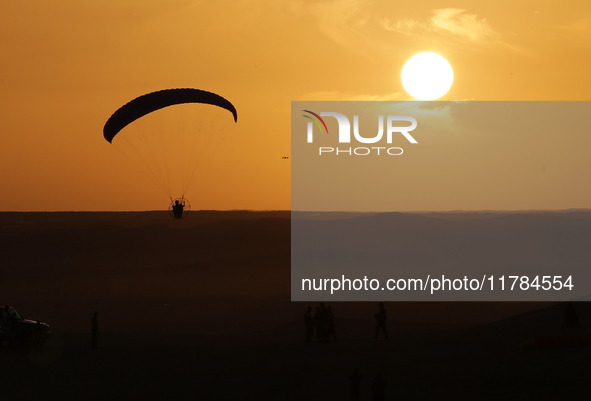 The photo, taken in Oued Souf, Algeria, on November 16, 2024, shows a sunset during the 6th International Saharan Tourism Festival (FITS). O...