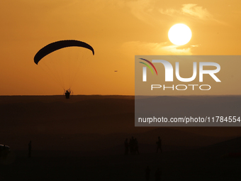 The photo, taken in Oued Souf, Algeria, on November 16, 2024, shows a sunset during the 6th International Saharan Tourism Festival (FITS). O...