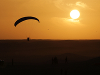 The photo, taken in Oued Souf, Algeria, on November 16, 2024, shows a sunset during the 6th International Saharan Tourism Festival (FITS). O...