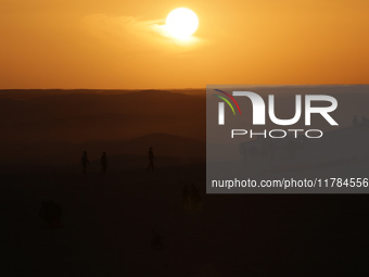 The photo, taken in Oued Souf, Algeria, on November 16, 2024, shows a sunset during the 6th International Saharan Tourism Festival (FITS). O...