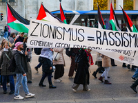 A demonstration in Munich, Germany, on November 16, 2024, includes pro-Palestinian demonstrators and pro-Israeli counter-demonstrators with...