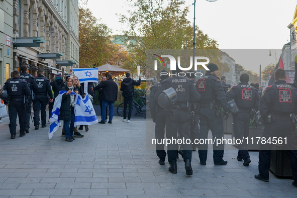 A demonstration in Munich, Germany, on November 16, 2024, includes pro-Palestinian demonstrators and pro-Israeli counter-demonstrators with...