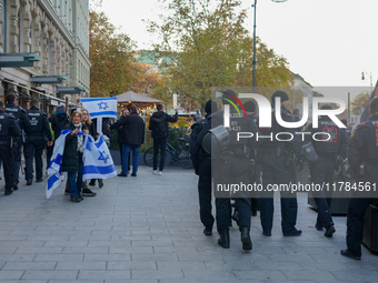 A demonstration in Munich, Germany, on November 16, 2024, includes pro-Palestinian demonstrators and pro-Israeli counter-demonstrators with...