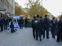 A demonstration in Munich, Germany, on November 16, 2024, includes pro-Palestinian demonstrators and pro-Israeli counter-demonstrators with...