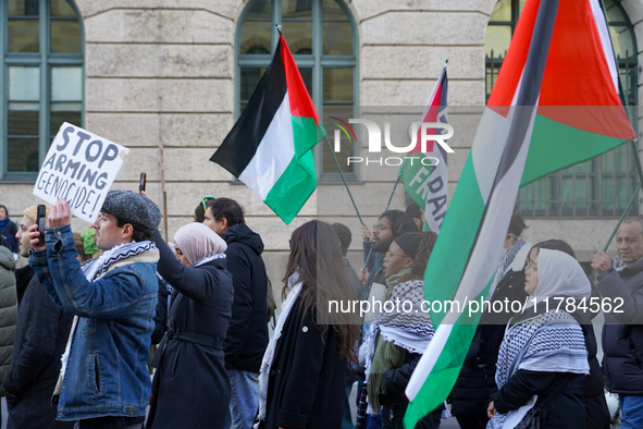 A demonstration in Munich, Germany, on November 16, 2024, includes pro-Palestinian demonstrators and pro-Israeli counter-demonstrators with...