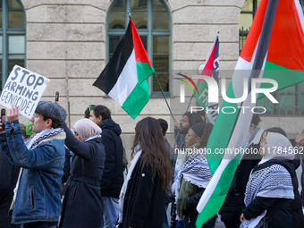 A demonstration in Munich, Germany, on November 16, 2024, includes pro-Palestinian demonstrators and pro-Israeli counter-demonstrators with...