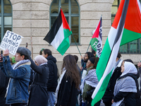 A demonstration in Munich, Germany, on November 16, 2024, includes pro-Palestinian demonstrators and pro-Israeli counter-demonstrators with...