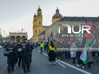 A demonstration in Munich, Germany, on November 16, 2024, includes pro-Palestinian demonstrators and pro-Israeli counter-demonstrators with...