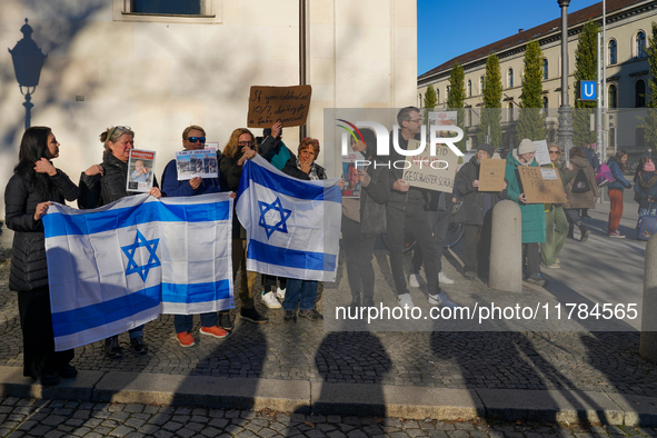 A demonstration in Munich, Germany, on November 16, 2024, includes pro-Palestinian demonstrators and pro-Israeli counter-demonstrators with...