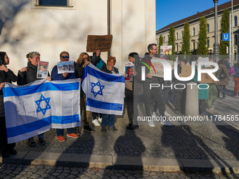 A demonstration in Munich, Germany, on November 16, 2024, includes pro-Palestinian demonstrators and pro-Israeli counter-demonstrators with...