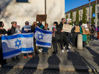 A demonstration in Munich, Germany, on November 16, 2024, includes pro-Palestinian demonstrators and pro-Israeli counter-demonstrators with...