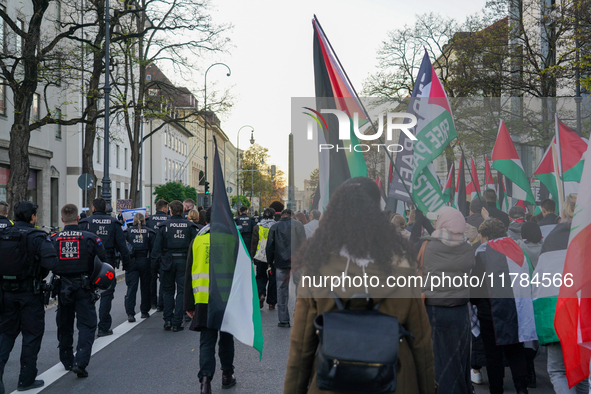 A demonstration in Munich, Germany, on November 16, 2024, includes pro-Palestinian demonstrators and pro-Israeli counter-demonstrators with...