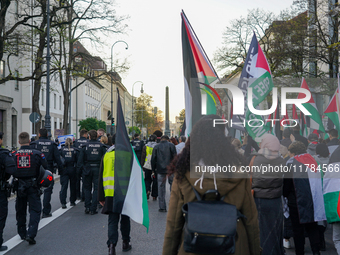 A demonstration in Munich, Germany, on November 16, 2024, includes pro-Palestinian demonstrators and pro-Israeli counter-demonstrators with...