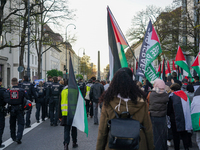 A demonstration in Munich, Germany, on November 16, 2024, includes pro-Palestinian demonstrators and pro-Israeli counter-demonstrators with...