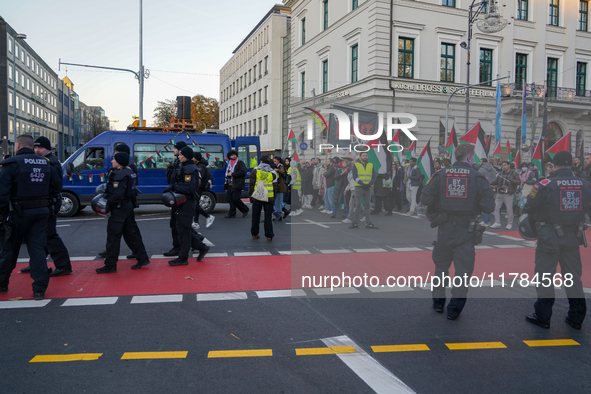 A demonstration in Munich, Germany, on November 16, 2024, includes pro-Palestinian demonstrators and pro-Israeli counter-demonstrators with...