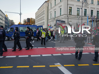 A demonstration in Munich, Germany, on November 16, 2024, includes pro-Palestinian demonstrators and pro-Israeli counter-demonstrators with...