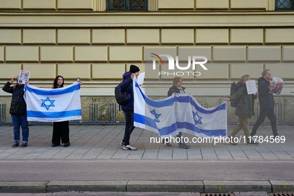 A demonstration in Munich, Germany, on November 16, 2024, includes pro-Palestinian demonstrators and pro-Israeli counter-demonstrators with...