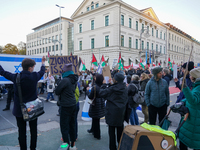 A demonstration in Munich, Germany, on November 16, 2024, includes pro-Palestinian demonstrators and pro-Israeli counter-demonstrators with...