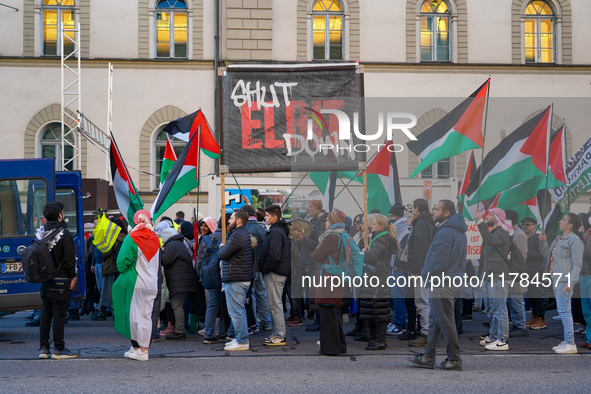 A demonstration in Munich, Germany, on November 16, 2024, includes pro-Palestinian demonstrators and pro-Israeli counter-demonstrators with...