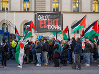 A demonstration in Munich, Germany, on November 16, 2024, includes pro-Palestinian demonstrators and pro-Israeli counter-demonstrators with...