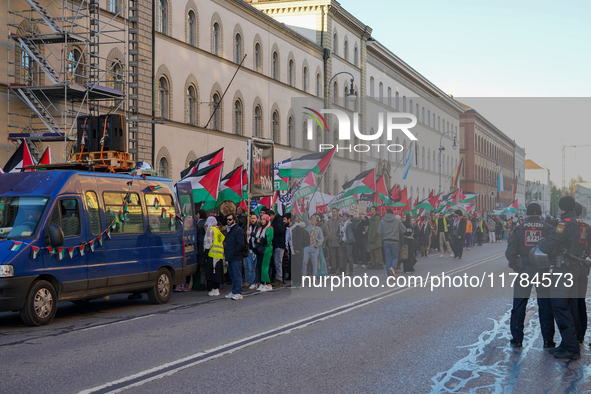 A demonstration in Munich, Germany, on November 16, 2024, includes pro-Palestinian demonstrators and pro-Israeli counter-demonstrators with...