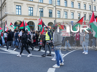 A demonstration in Munich, Germany, on November 16, 2024, includes pro-Palestinian demonstrators and pro-Israeli counter-demonstrators with...