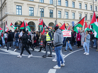 A demonstration in Munich, Germany, on November 16, 2024, includes pro-Palestinian demonstrators and pro-Israeli counter-demonstrators with...