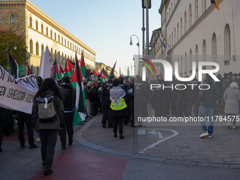 A demonstration in Munich, Germany, on November 16, 2024, includes pro-Palestinian demonstrators and pro-Israeli counter-demonstrators with...