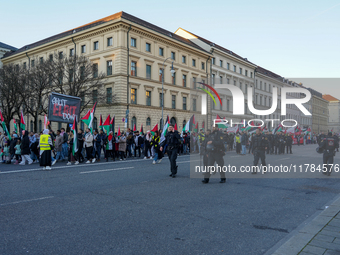 A demonstration in Munich, Germany, on November 16, 2024, includes pro-Palestinian demonstrators and pro-Israeli counter-demonstrators with...