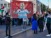 A demonstration in Munich, Germany, on November 16, 2024, includes pro-Palestinian demonstrators and pro-Israeli counter-demonstrators with...