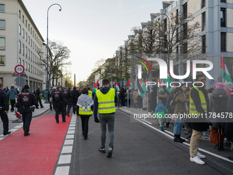 A demonstration in Munich, Germany, on November 16, 2024, includes pro-Palestinian demonstrators and pro-Israeli counter-demonstrators with...