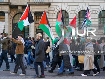 A demonstration in Munich, Germany, on November 16, 2024, includes pro-Palestinian demonstrators and pro-Israeli counter-demonstrators with...