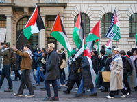 A demonstration in Munich, Germany, on November 16, 2024, includes pro-Palestinian demonstrators and pro-Israeli counter-demonstrators with...