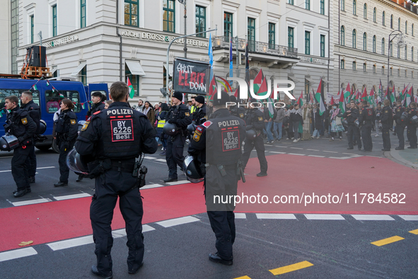 A demonstration in Munich, Germany, on November 16, 2024, includes pro-Palestinian demonstrators and pro-Israeli counter-demonstrators with...