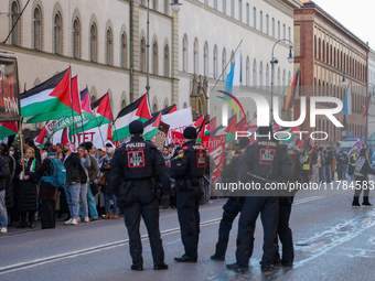 A demonstration in Munich, Germany, on November 16, 2024, includes pro-Palestinian demonstrators and pro-Israeli counter-demonstrators with...