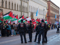 A demonstration in Munich, Germany, on November 16, 2024, includes pro-Palestinian demonstrators and pro-Israeli counter-demonstrators with...