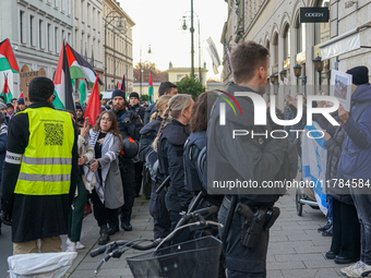 A demonstration in Munich, Germany, on November 16, 2024, includes pro-Palestinian demonstrators and pro-Israeli counter-demonstrators with...