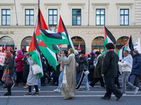 A demonstration in Munich, Germany, on November 16, 2024, includes pro-Palestinian demonstrators and pro-Israeli counter-demonstrators with...