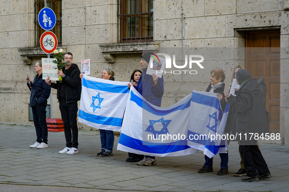 A demonstration in Munich, Germany, on November 16, 2024, includes pro-Palestinian demonstrators and pro-Israeli counter-demonstrators with...