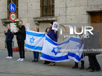 A demonstration in Munich, Germany, on November 16, 2024, includes pro-Palestinian demonstrators and pro-Israeli counter-demonstrators with...