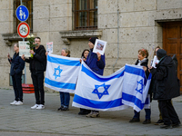 A demonstration in Munich, Germany, on November 16, 2024, includes pro-Palestinian demonstrators and pro-Israeli counter-demonstrators with...