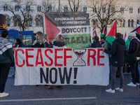 A demonstration in Munich, Germany, on November 16, 2024, includes pro-Palestinian demonstrators and pro-Israeli counter-demonstrators with...